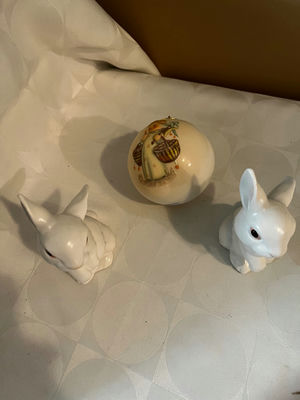 Two white ceramic bunny figurines with a decorative painted ball - Image 1 of 1