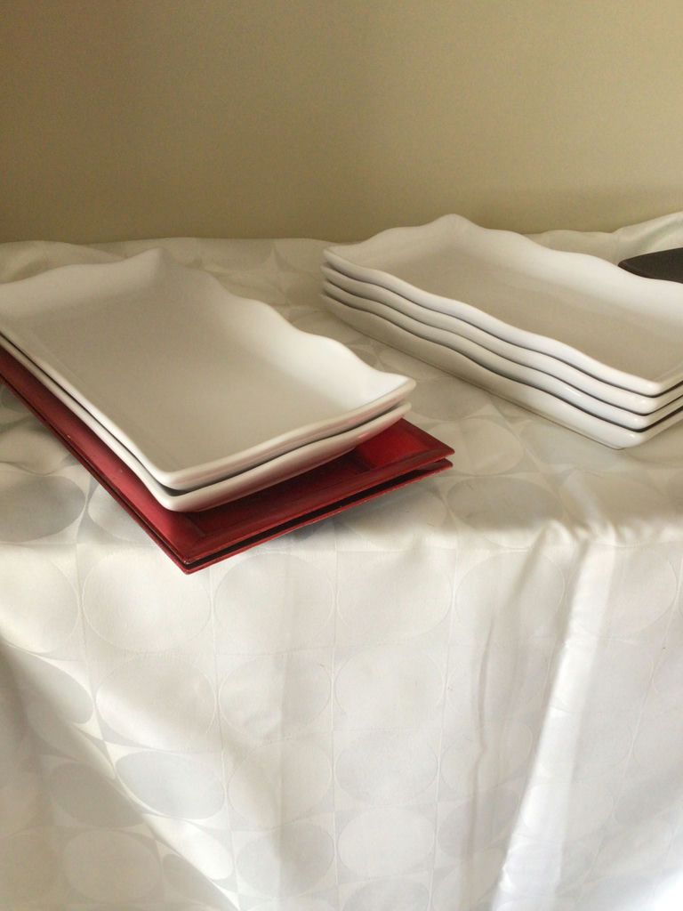 White rectangular plates and a red and a black tray - image 2 of 2