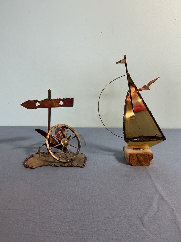 Two metal sculptures: signpost wheel and sailboat - image 2 of 3