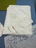Assorted linen textiles: lace, embroidery, and plaid fabric - thumbnail 1 of 6