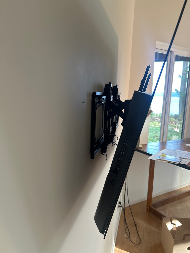 Wall-mounted LG LED TV with mounting hardware, accessories - image 4 of 5