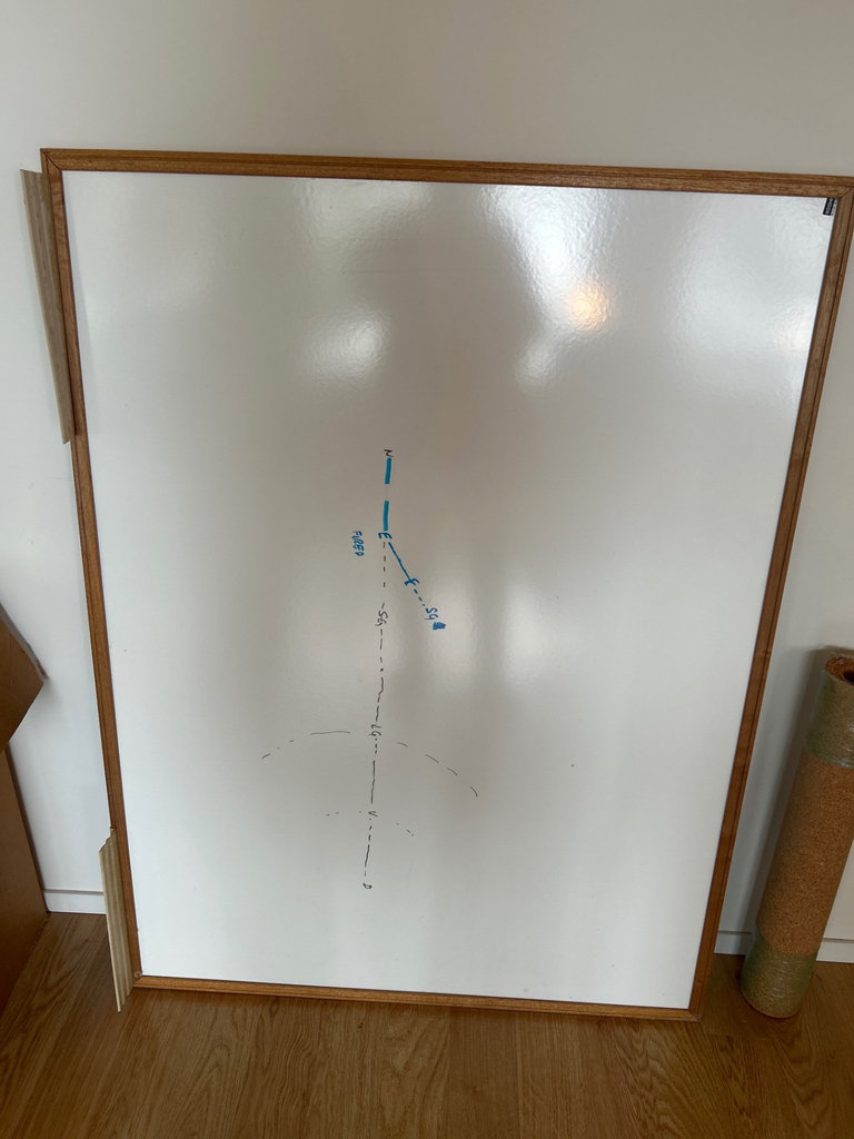 Red office chair with whiteboard and assorted office supplies - image 7 of 9
