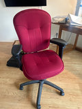 Red office chair with whiteboard and assorted office supplies - thumbnail 1 of 9