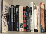 Assorted Fiction and Nonfiction Books with Decorative Ivy Plant - thumbnail 1 of 4