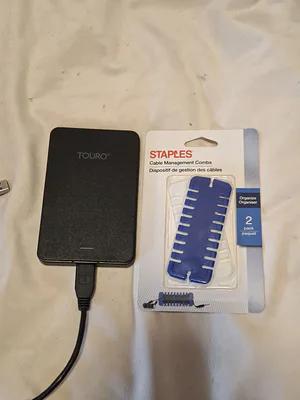 HGST Touro Mobile MX3 500GB External Hard Drive and Staples Cable Management Combs - Image 1 of 3