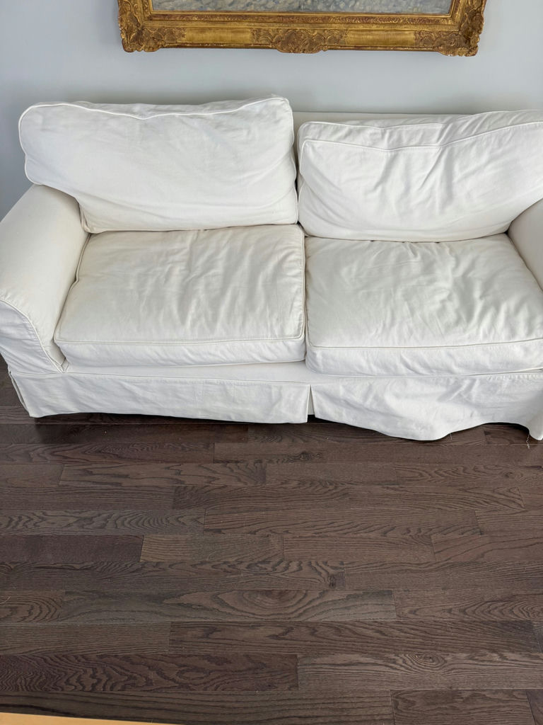 White slipcovered sofa - image 1 of 3