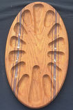 Pair of oval wooden boards with multiple recessed slots and decorative inlays - thumbnail 2 of 4