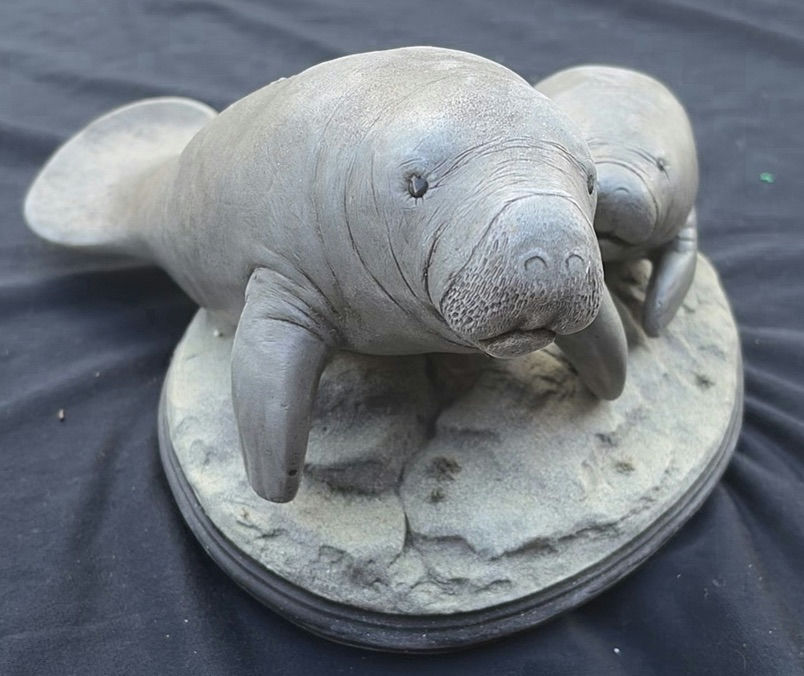 Two Manatee Sculptures on an Oval Base - image 2 of 4