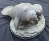 Two Manatee Sculptures on an Oval Base - thumbnail 2 of 4