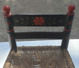 Small black-painted wooden chair with woven seat and floral decoration - thumbnail 3 of 8