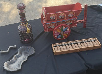 Assorted vintage decorative items: painted wooden wagon, abacus, bottle, dish, and crank - Image 1 of 7