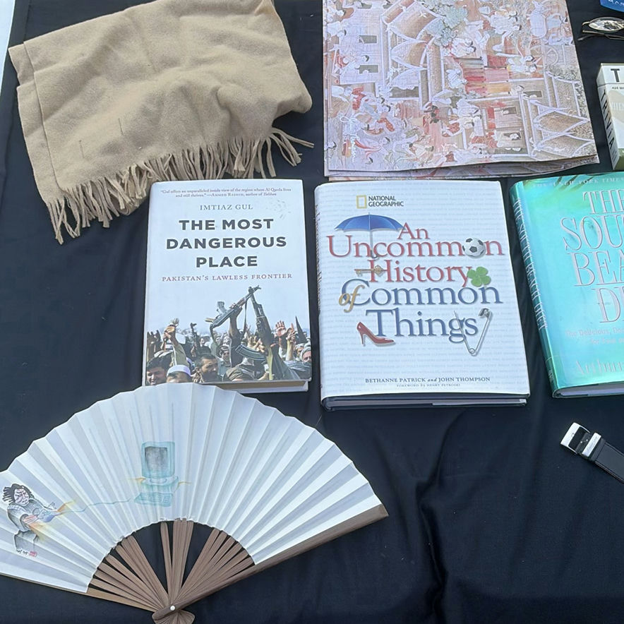Assorted books, travel journals, and personal accessories - image 1 of 13