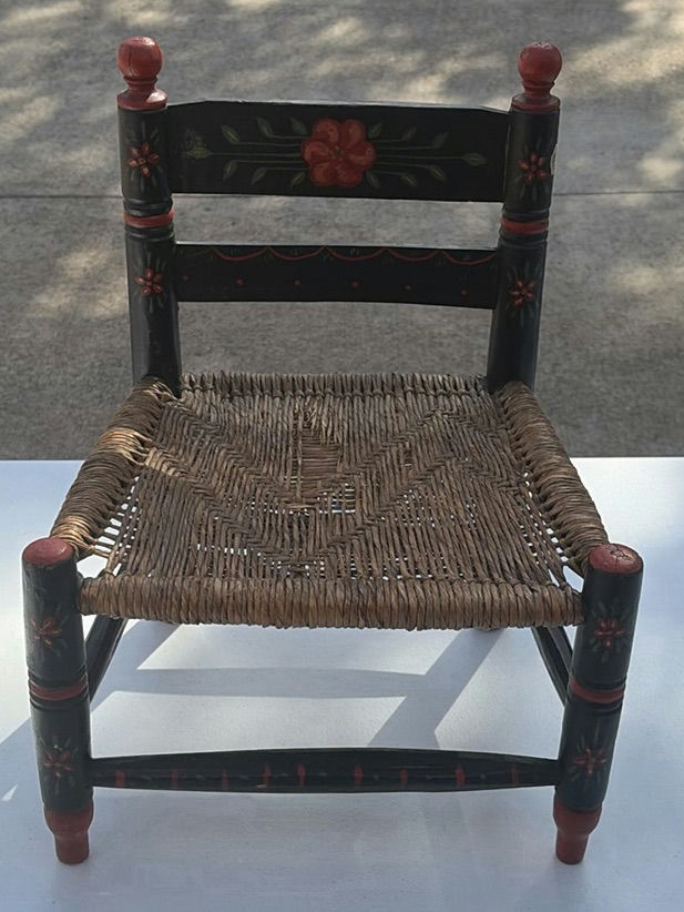 Small black-painted wooden chair with woven seat and floral decoration - image 1 of 8