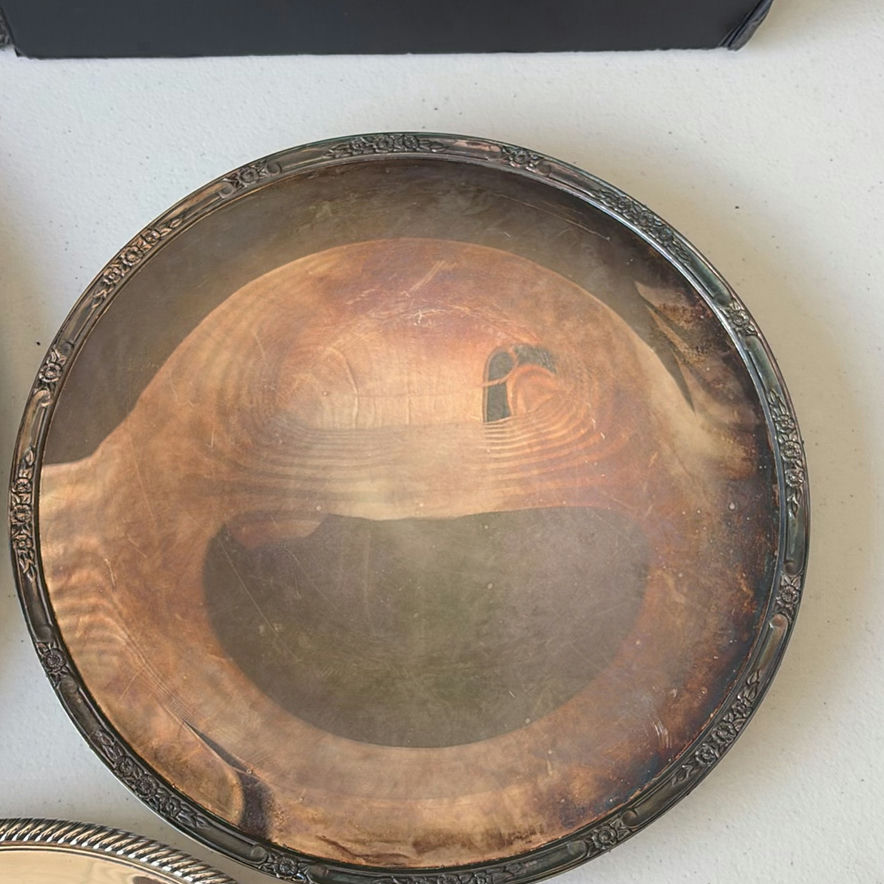 Assorted silver plate serving trays and bowls with a patterned woven rug - image 8 of 8
