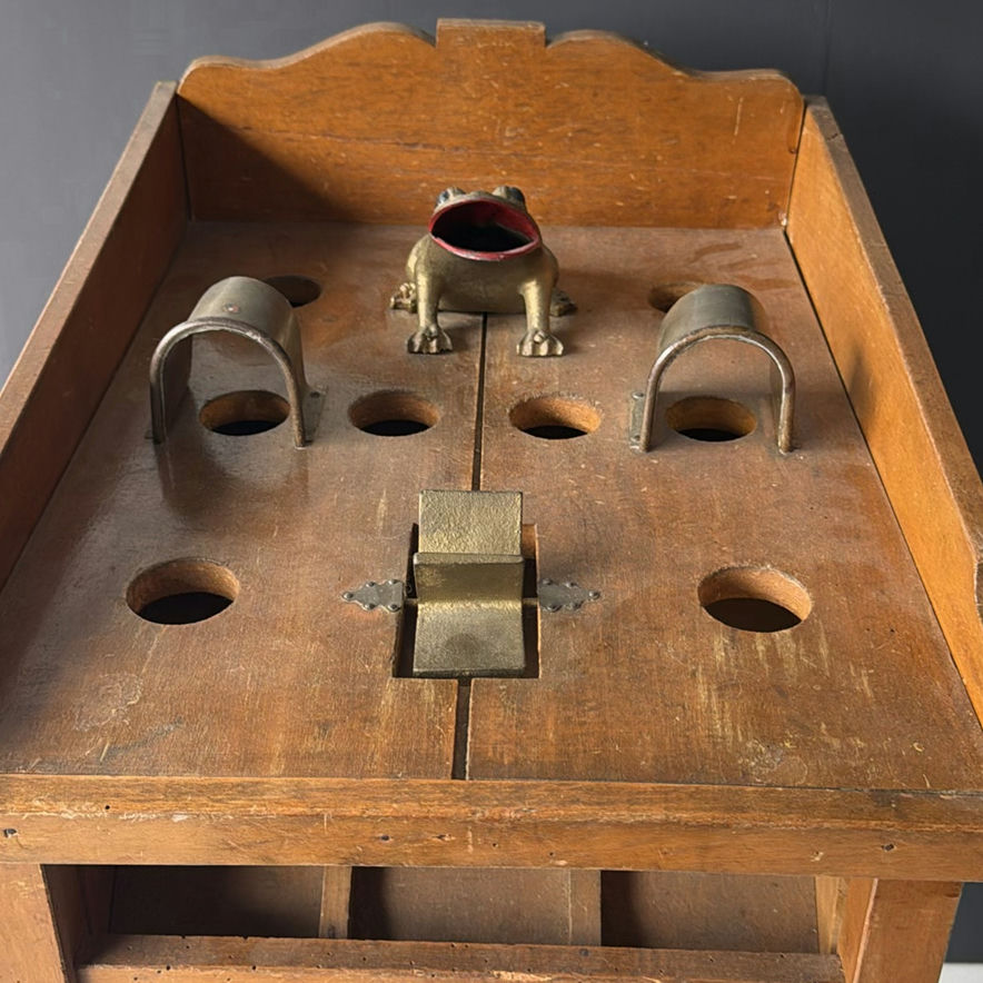 Vintage wooden display stand with slotted compartments and frog sculpture - image 2 of 9
