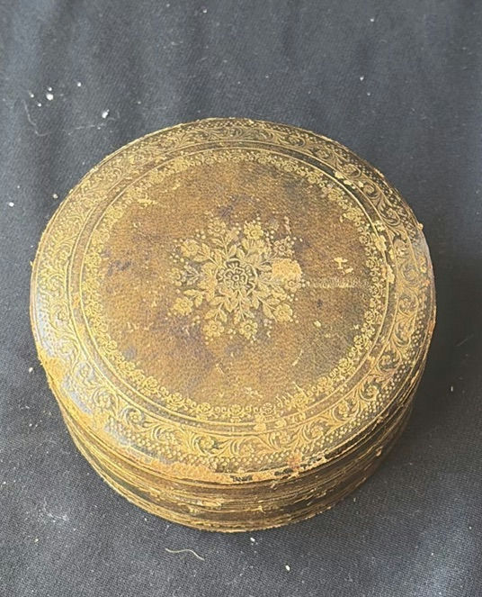 Assorted decorative items including penguin figurines, an ornate tin, a jewelry box with knotted bracelets, a glass sculpture, and round coasters - image 2 of 8