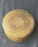 Assorted decorative items including penguin figurines, an ornate tin, a jewelry box with knotted bracelets, a glass sculpture, and round coasters - thumbnail 2 of 8