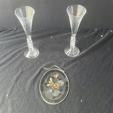 Two crystal champagne flutes and an oval enamel floral butterfly hanging ornament - thumbnail 1 of 4