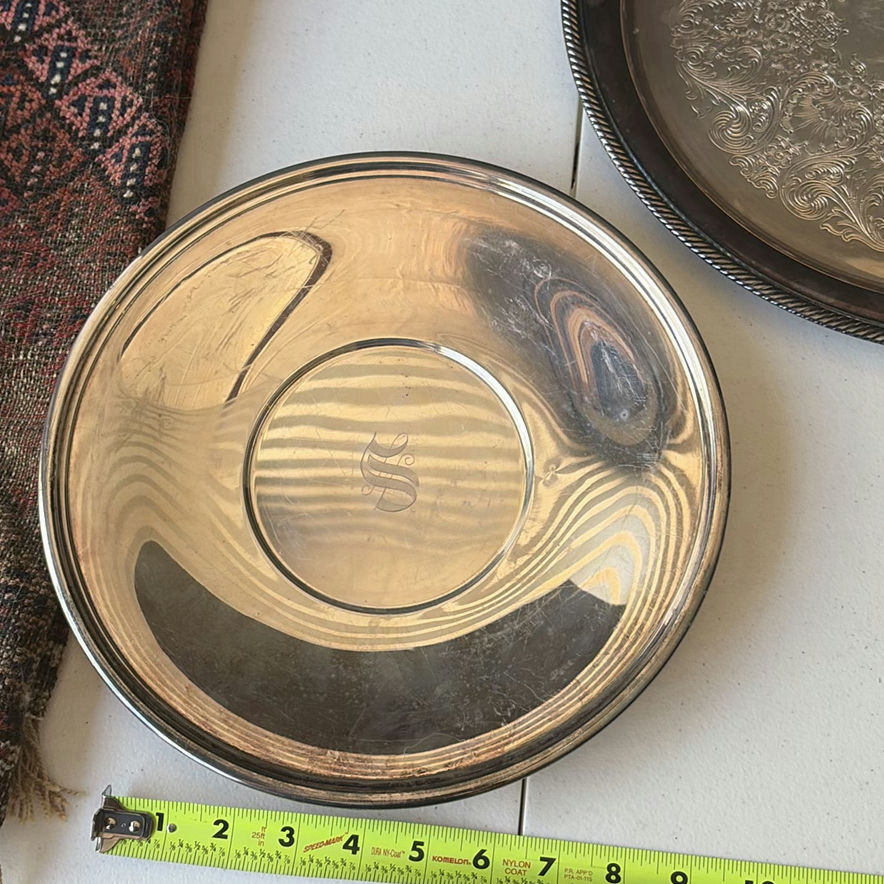 Assorted silver plate serving trays and bowls with a patterned woven rug - image 3 of 8