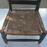 Small black-painted wooden chair with woven seat and floral decoration - thumbnail 2 of 8