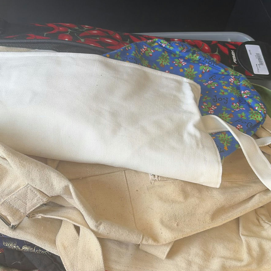 Clear plastic bin with assorted textiles - image 2 of 5