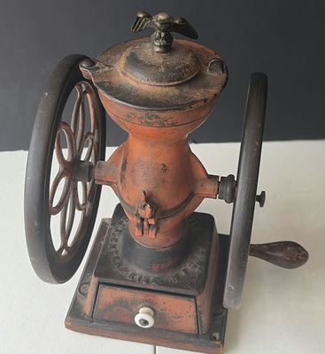 Antique hand-crank coffee grinder with dual wheels - Image 1 of 6
