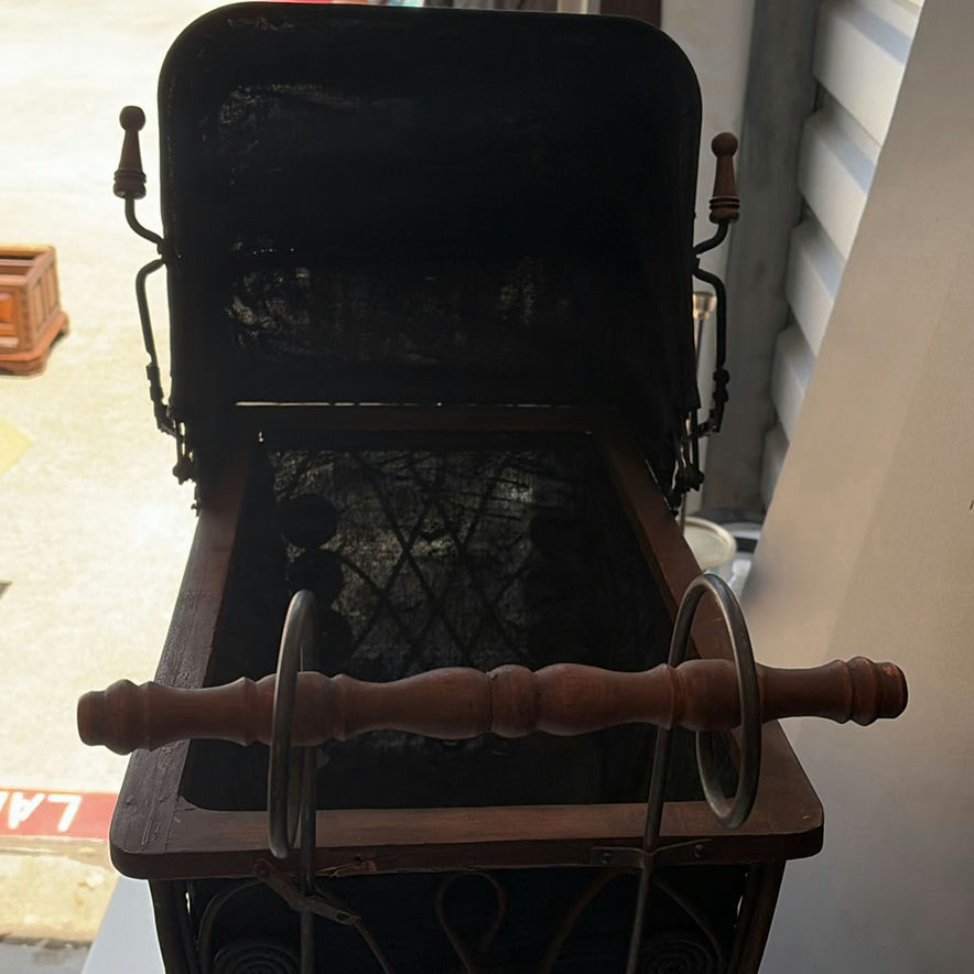 Antique wrought-iron baby carriage with decorative scrollwork - image 4 of 8