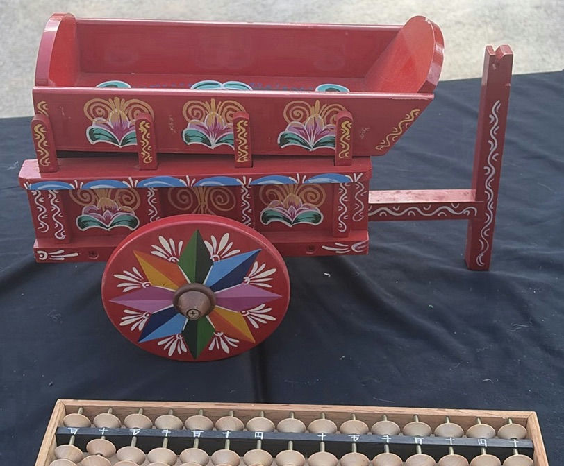 Assorted vintage decorative items: painted wooden wagon, abacus, bottle, dish, and crank - image 4 of 7