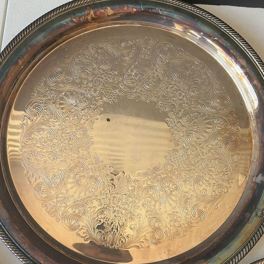Assorted silver plate serving trays and bowls with a patterned woven rug - image 6 of 8