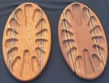 Pair of oval wooden boards with multiple recessed slots and decorative inlays - thumbnail 1 of 4