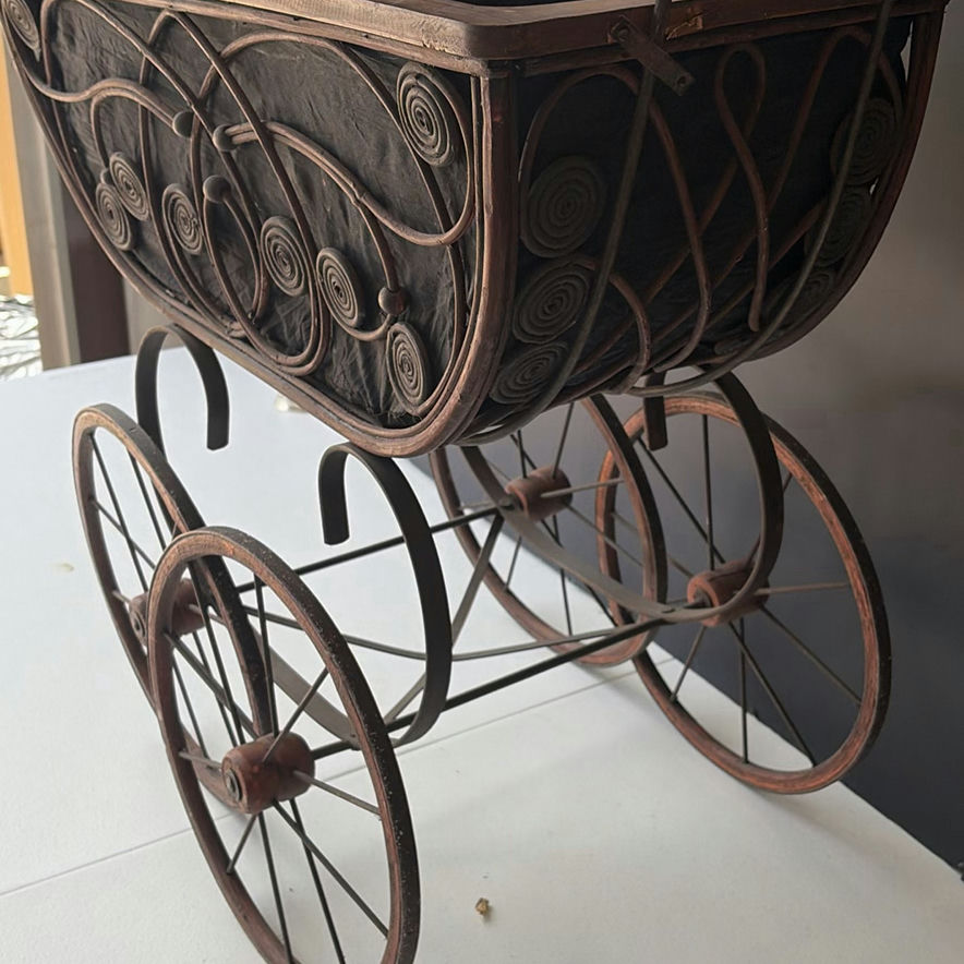 Antique wrought-iron baby carriage with decorative scrollwork - image 5 of 8