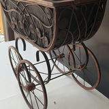 Antique wrought-iron baby carriage with decorative scrollwork - thumbnail 5 of 8