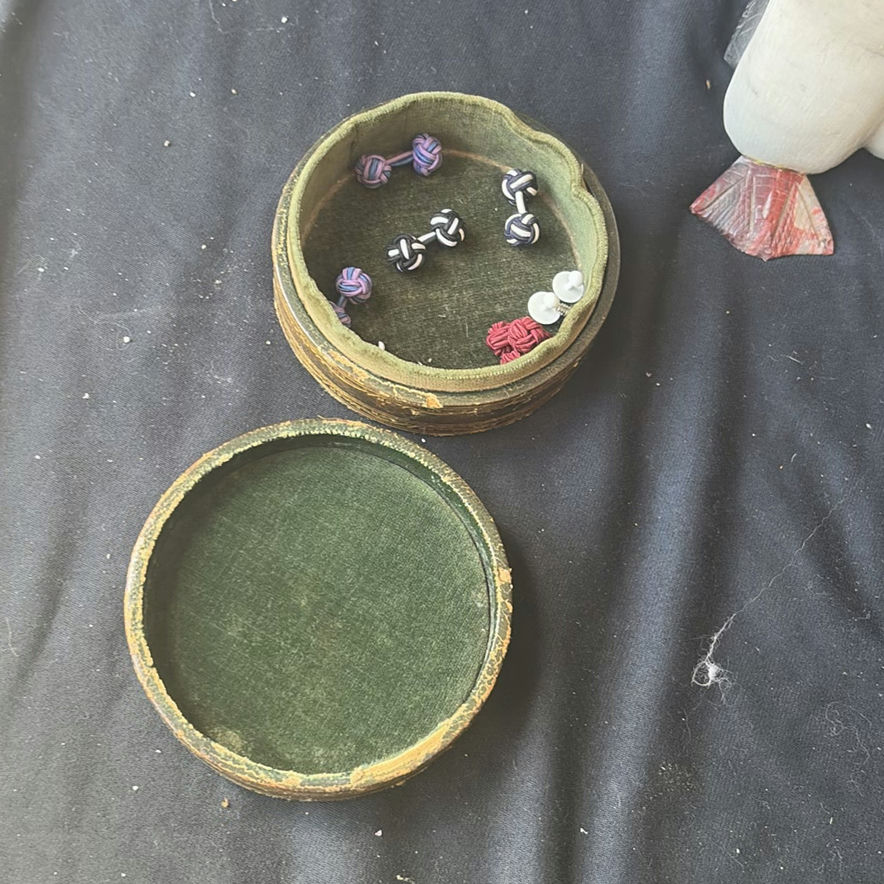Assorted decorative items including penguin figurines, an ornate tin, a jewelry box with knotted bracelets, a glass sculpture, and round coasters - image 3 of 8