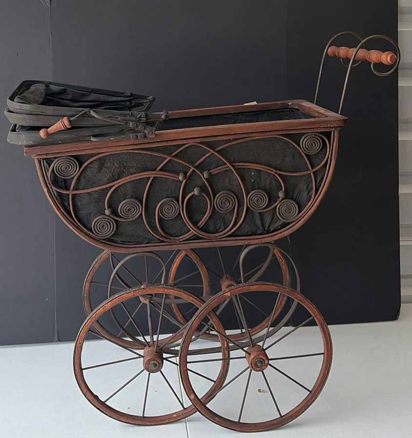 Antique wrought-iron baby carriage with decorative scrollwork - image 1 of 8