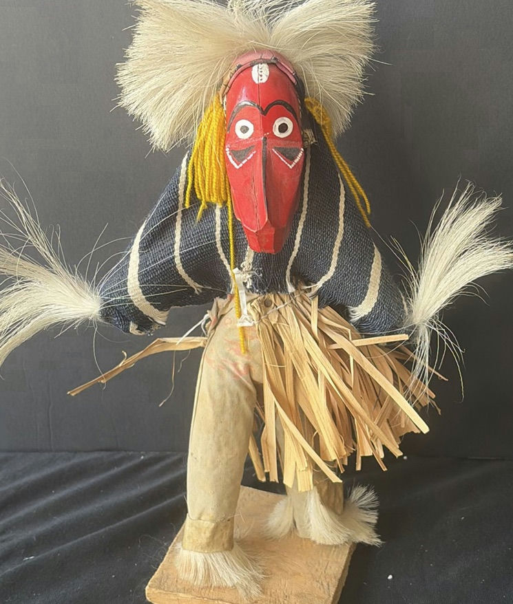 Two straw-skirted masked figures with a green frog sculpture - image 3 of 4