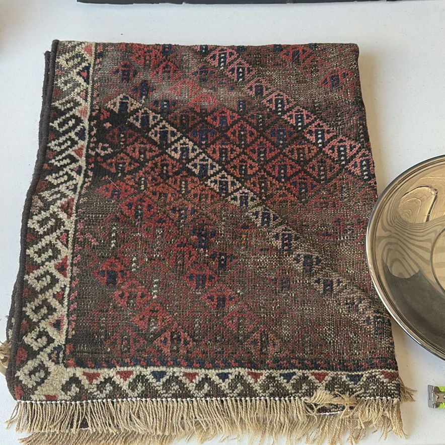 Assorted silver plate serving trays and bowls with a patterned woven rug - image 2 of 8