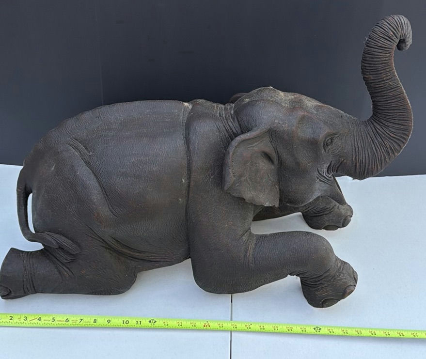 Dark elephant statue with raised trunk - image 1 of 8