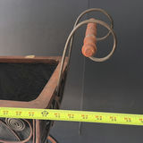 Antique wrought-iron baby carriage with decorative scrollwork - thumbnail 6 of 8