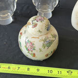 Glass hurricane vases, a floral porcelain ginger jar, and a gold-faced cat sculpture - thumbnail 2 of 6