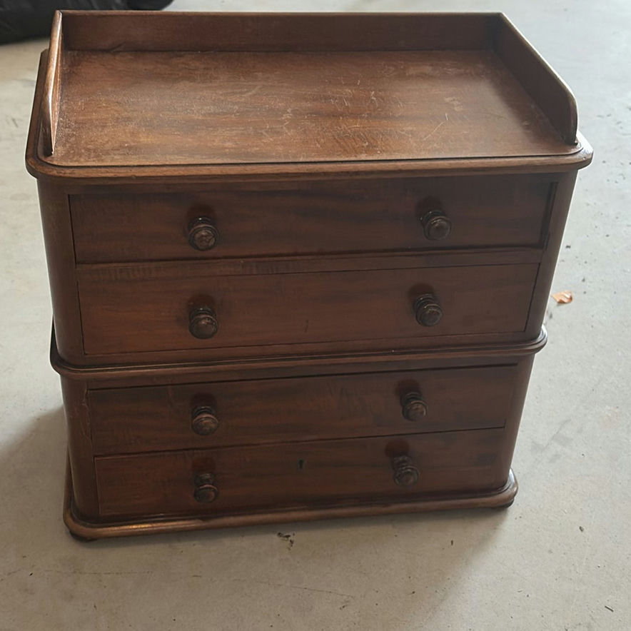 Wooden four-drawer dresser with raised top edge - image 1 of 5