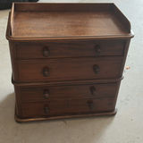 Wooden four-drawer dresser with raised top edge - thumbnail 1 of 5