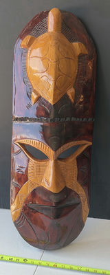 Vertical carved wooden mask sculpture with turtle motif - Image 1 of 5
