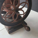 Antique hand-crank coffee grinder with dual wheels - thumbnail 3 of 6