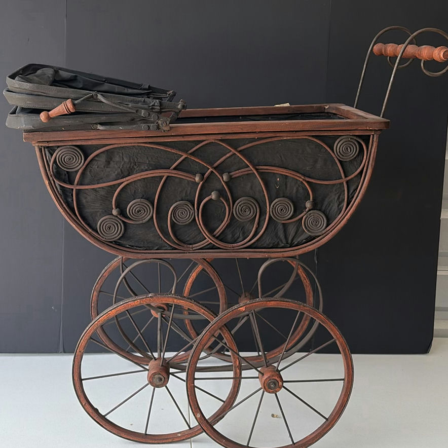 Antique wrought-iron baby carriage with decorative scrollwork - image 2 of 8