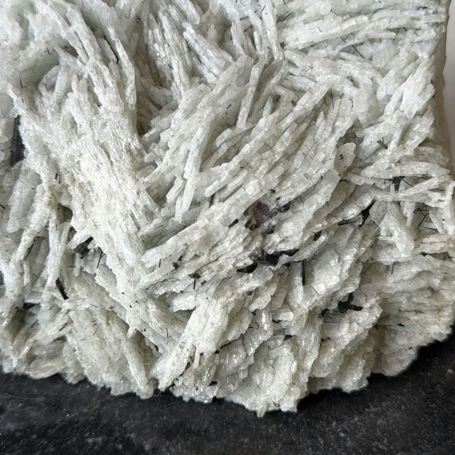 White fibrous crystal mineral on rock matrix - image 2 of 5