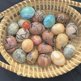 Hand woven basket from South Carolina filled with hand painted stone eggs - thumbnail 2 of 3