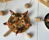 Cloth dolls, wooden folk-art figures, and a glitter globe - thumbnail 2 of 8