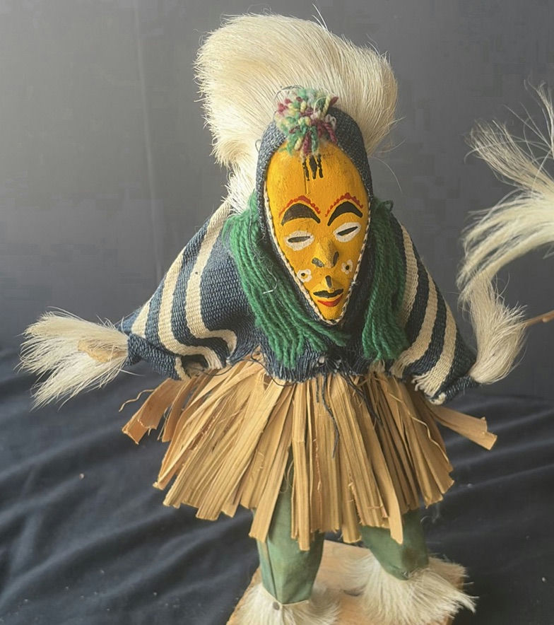 Two straw-skirted masked figures with a green frog sculpture - image 2 of 4