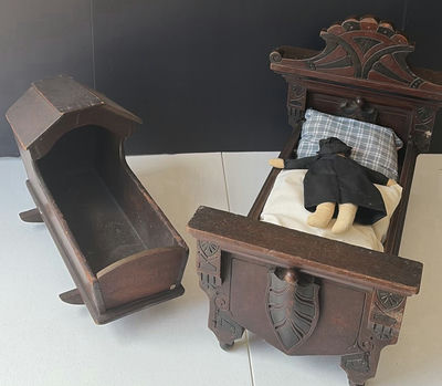 Antique carved wooden doll bed with doll and cradle piece - Image 1 of 7
