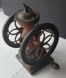 Antique hand-crank coffee grinder with dual wheels - thumbnail 2 of 6